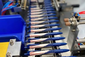 Patriotic pens lined up in a factory