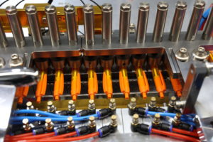 Orange pens lined up in a factory