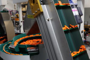Orange tubes in a factory machine