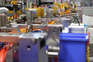 factory machines with a bunch of wires and blue boxes
